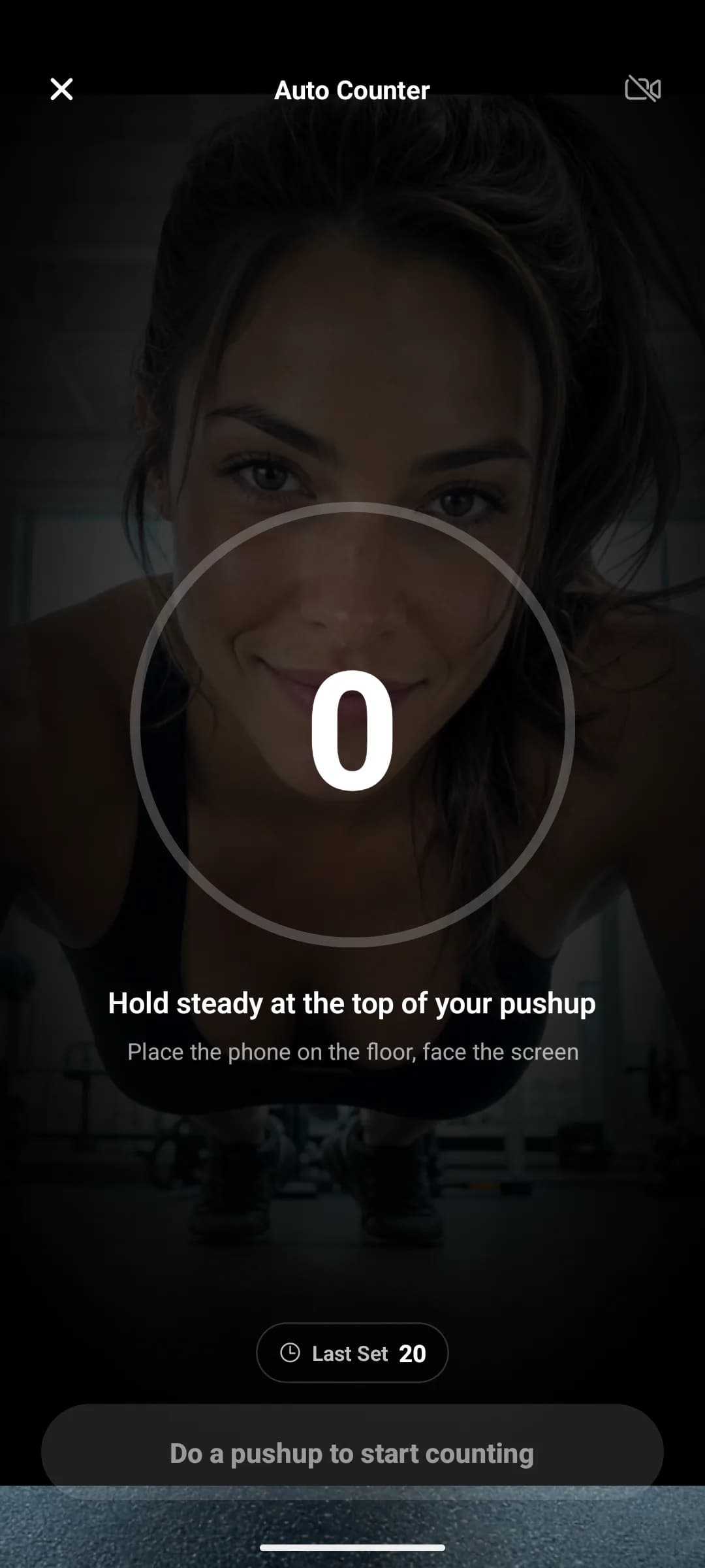 JustGains pushup Auto Counter calibrating, showing the depth ring and the instruction to hold steady at the top of a pushup
